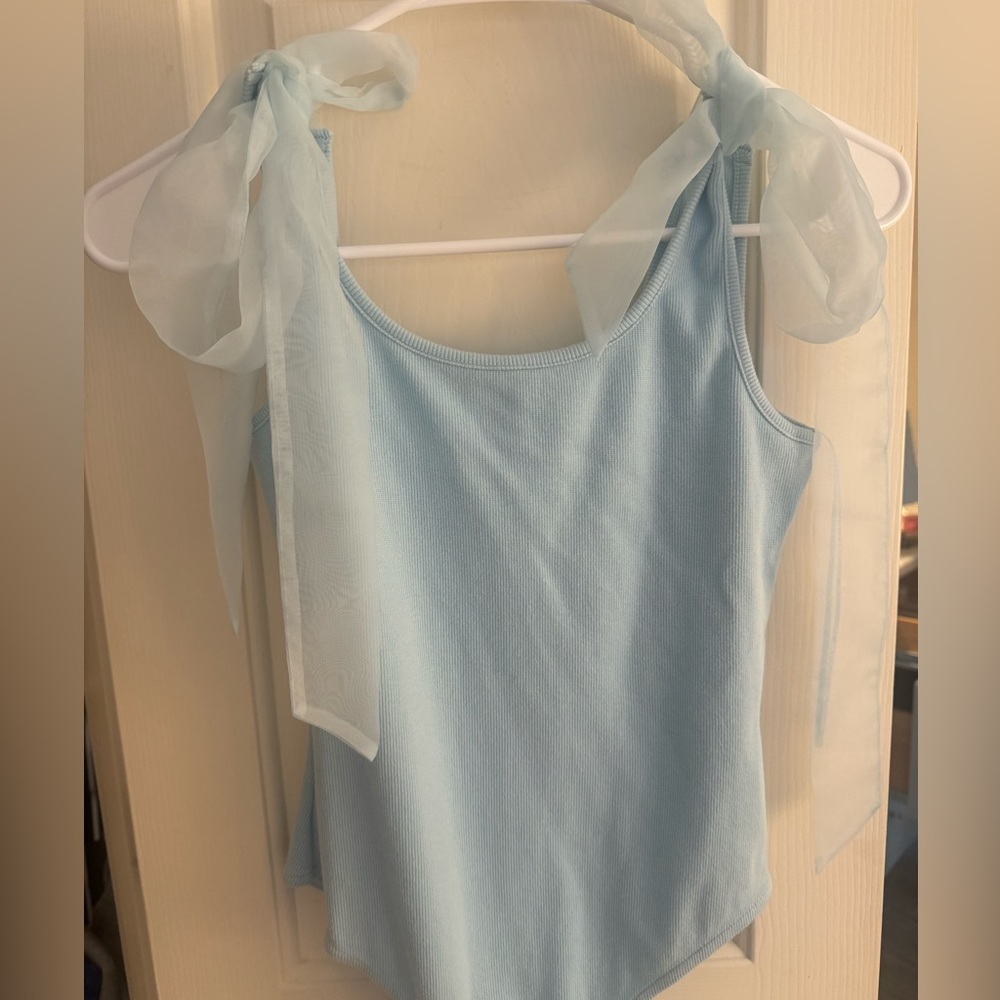 blue bodysuit with lace bows